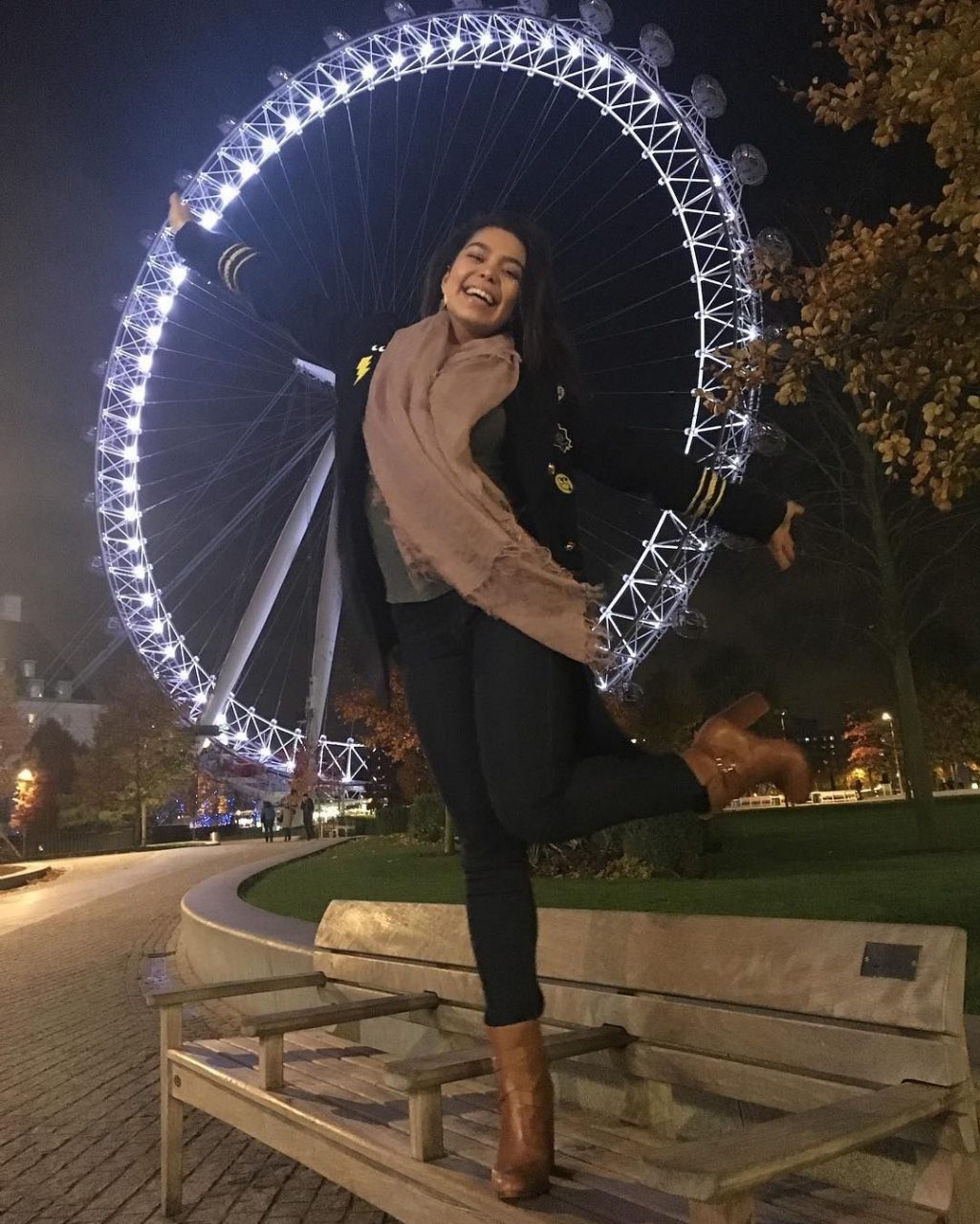 Auli'i Cravalho Poses In Front Of Giant Wheel